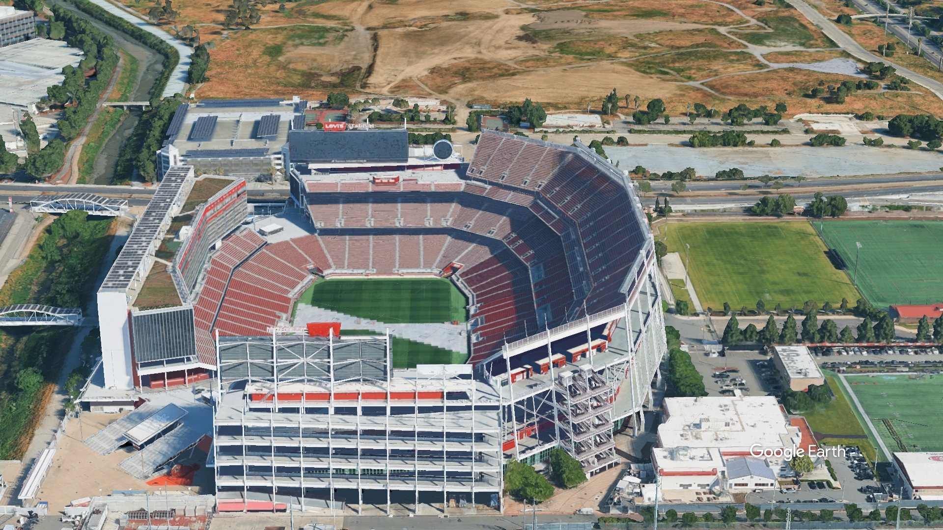Wide-angle external view of Levi's Stadium displaying the complete venue and parking facilities